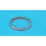 A platinum diamond full eternity ring.