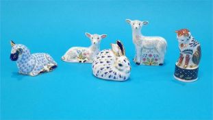 Five Royal Crown Derby paperweights of lambs, rabbit and a cat (no boxes or certificates).