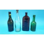 Four old glass bottles.