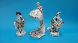 A pair of Continental porcelain figures of a gallant and a lady, blue marks in underglaze blue and a
