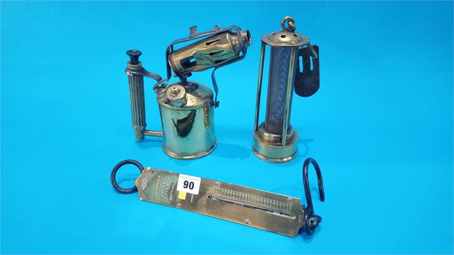A Miners lamp, Salter scales and a blow lamp.