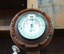 A T.B. Winter and Sons of Newcastle upon Tyne walnut circular barometer. 21cm diameter