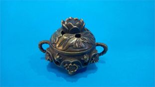 A small Chinese bronze censor, with seal mark to base. 5 cm high 9 cm diameter