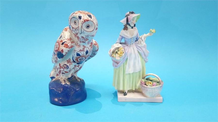 An Imari decorated Owl. 18cm high and a Royal Doulton figure 'Spring Flowers'.