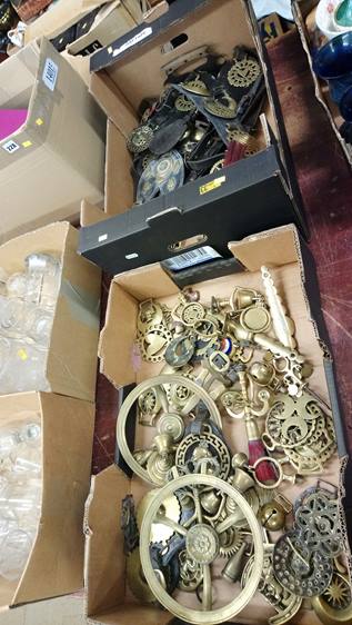 Two trays of horse brasses and saddlery brasses.