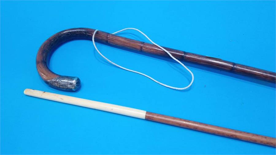 An ivory mounted walking cane carved with ribbons and ivory tip and another cane. (2) 85cm long - Image 3 of 3