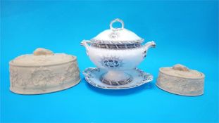 A Victorian soup tureen and stand and two oval game pie dishes. (3)