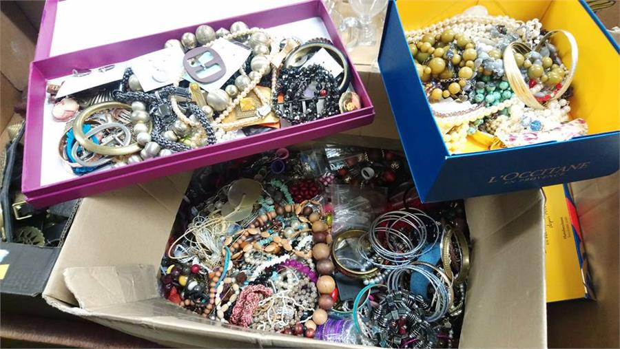 A large box of costume jewellery.