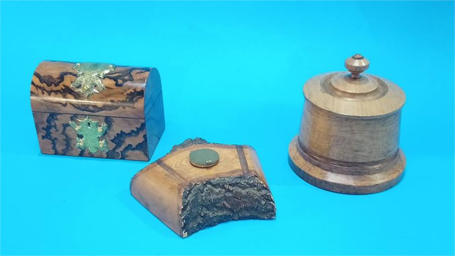 A walnut dome top casket with two bottles, 15 cm wide, a treen circular tobacco jar and a treen