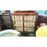 A mahogany glazed bookcase.