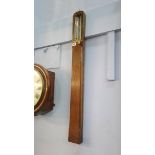 An oak cased stick barometer by S.A. Cail of 42 and 43 Quayside, Newcastle Upon Tyne. 93cm long