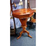 A Victorian walnut sewing table.