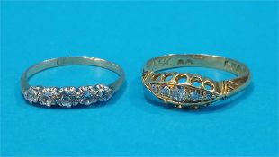 Two 18ct gold five stone diamond rings.