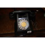 A Bakelite telephone with cheese drawer