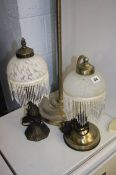 Two table lamps and a floor lamp