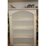 White open bookcase, tools, metal headboard