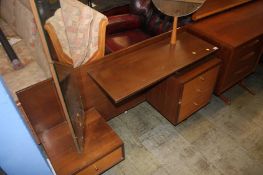 An unusual G Plan? teak dressing table with swivel mirror, circular mirror and four drawers