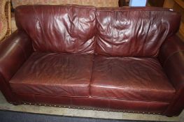 A Wade leather two seater settee