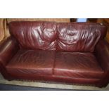 A Wade leather two seater settee