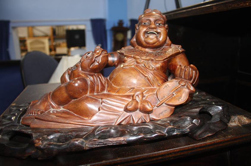 A carved wood Oriental figure group