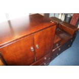 An oak chest of drawers and a dressing chest