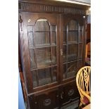 Two door oak glazed bookcase