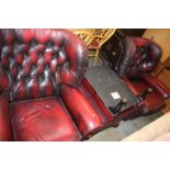 Two Chesterfield type armchairs and two footstools