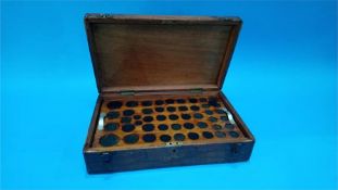 A mahogany coin case