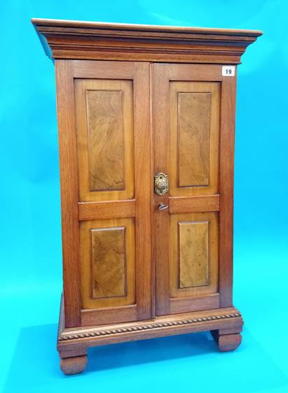 An apprentice built mahogany miniature wardrobe