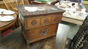 A carved hardwood Campaign style folding writing desk, the top carved with 'Queen's Own Cameron