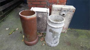 Two ceramic sinks and two chimney pots