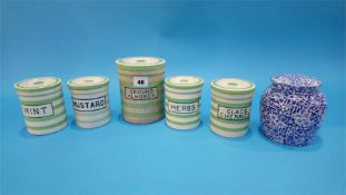 Four green and white striped Maling kitchen storage jars and one other