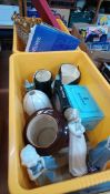 Two boxes including Lladro, Royal Doulton, Toby jugs etc.