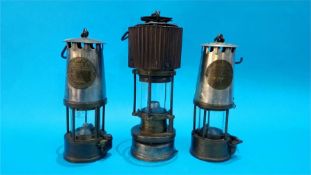 Two Eccles miner's lamps and a Patterson lamp. (3)
