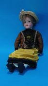 An Armand Marseille bisque headed doll, stamped 390, 6 1/2