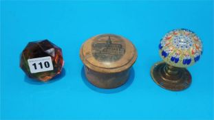 A glass Millefiori door knob, an amber door knob and treen Mauchline ware 'Glasgow' string box (3)