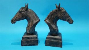 A pair of cast metal horse's head busts