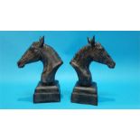 A pair of cast metal horse's head busts