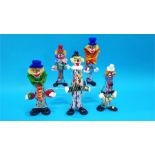A collection of 5 Murano style glass clowns