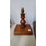 A table lamp made from teak from the RMS Mauretania