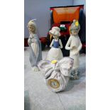 Three Nao figures and a Lladro clock