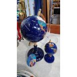 Two globes set with semi precious stones