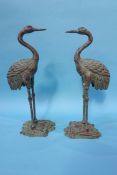 A pair of heron figures
