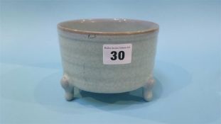 A small Chinese crackle glaze bowl on three feet