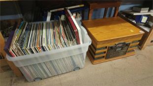Quantity of LPs a record player and a musical sewing box.