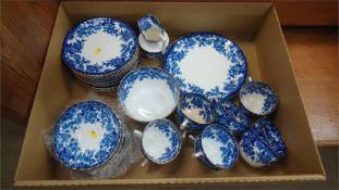 A box of blue and white tea ware