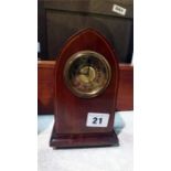 A small Edwardian mahogany mantle clock