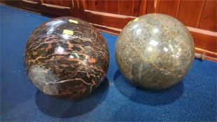 Two large granite spherical balls