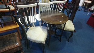 An Edwardian circular occasional table and pair of Edwardian chairs