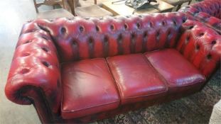 Red three seater Chesterfield